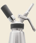 Closeup of CreamRight stainless steel whipped cream dispenser