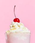 Milkshake topped with fresh whipped cream