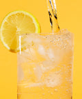 Glass of sparkling water with lemon garnish